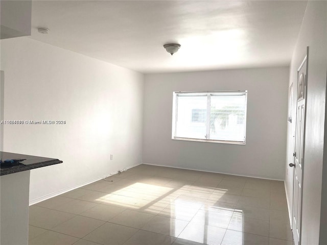 empty room with tile patterned floors