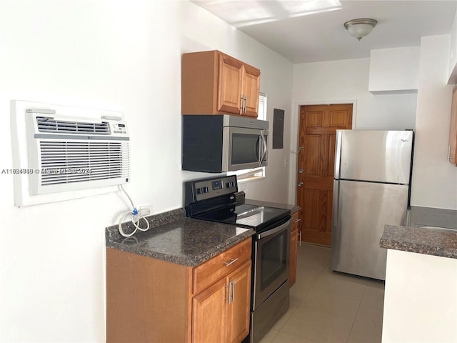 kitchen with stainless steel appliances and light tile patterned floors