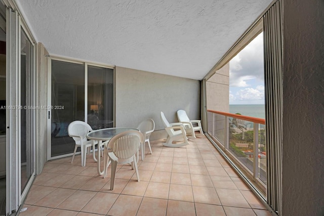 balcony featuring a water view