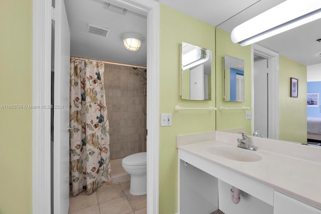 bathroom with toilet, vanity, a shower with shower curtain, and tile patterned flooring