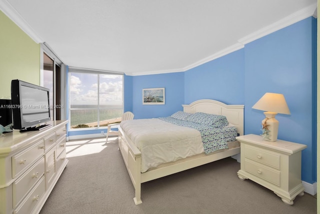 carpeted bedroom featuring crown molding