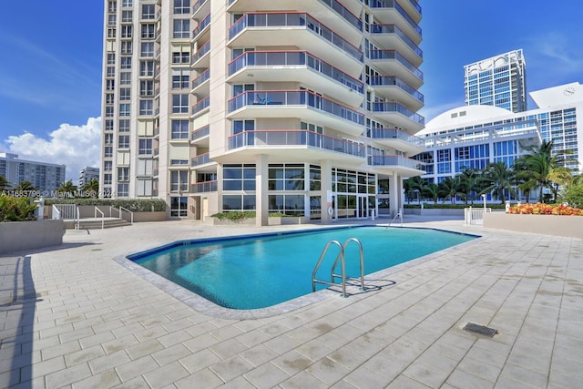 view of pool featuring a patio