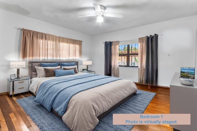 bedroom featuring hardwood / wood-style flooring and ceiling fan