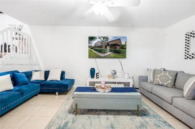 living room featuring ceiling fan and tile patterned flooring