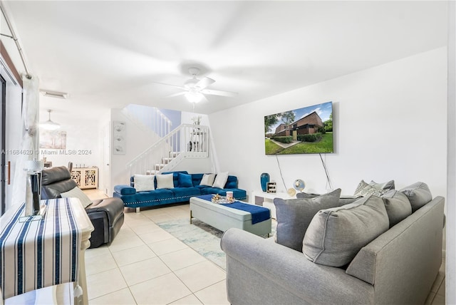 living room featuring ceiling fan and light tile patterned floors