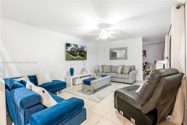 living room featuring ceiling fan and light tile patterned floors