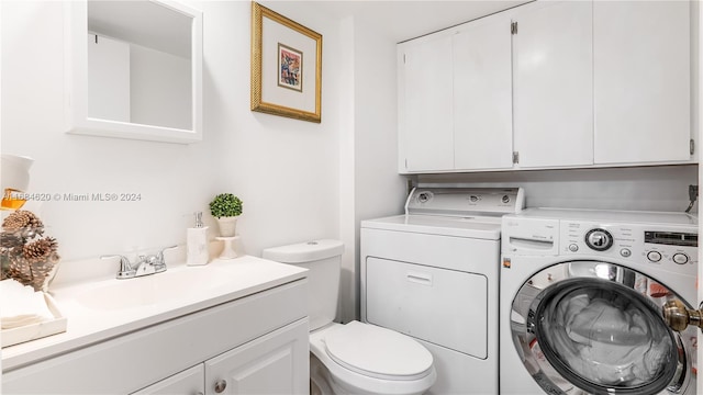 washroom featuring washer and dryer and sink