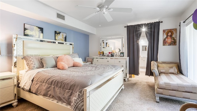 carpeted bedroom featuring connected bathroom and ceiling fan