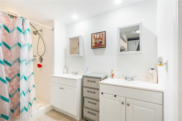 bathroom featuring vanity, tile patterned floors, and walk in shower