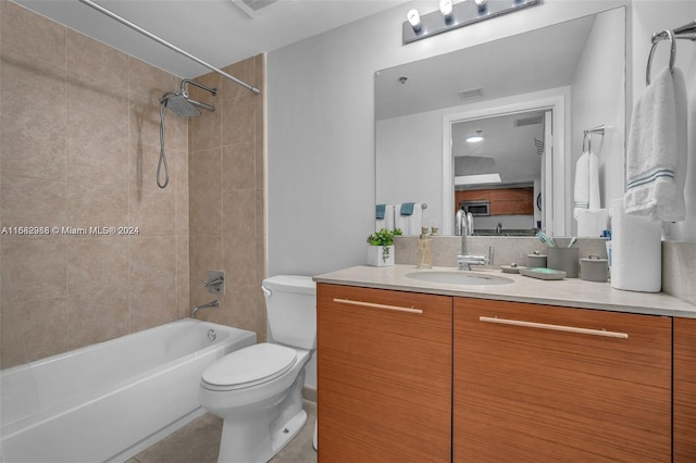 full bathroom with vanity, toilet, and tiled shower / bath