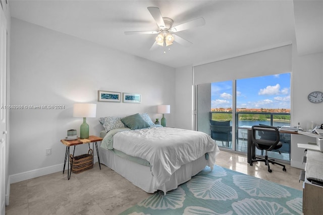 bedroom with access to exterior, a water view, and ceiling fan