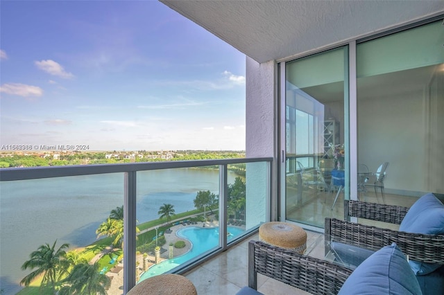 balcony featuring a water view