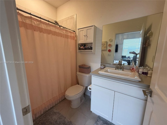 bathroom featuring vanity, curtained shower, toilet, and tile patterned flooring