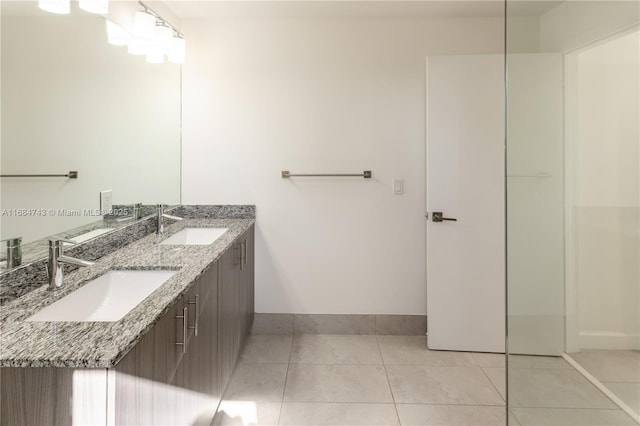 bathroom with tile patterned floors and vanity