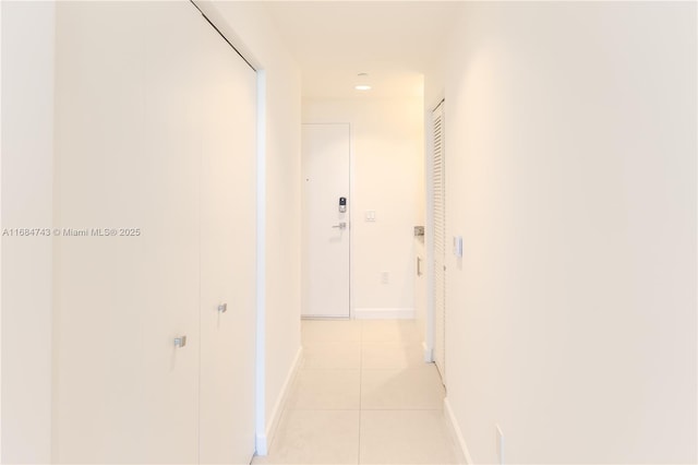 corridor with light tile patterned floors