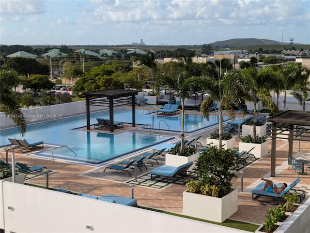 view of swimming pool featuring a mountain view