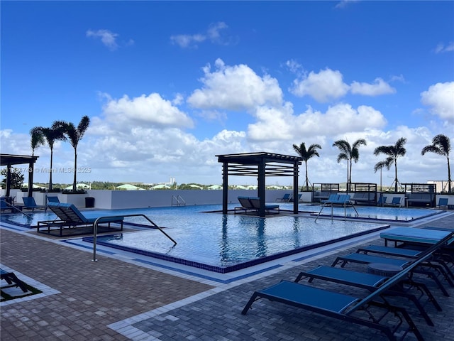 view of swimming pool with a patio area