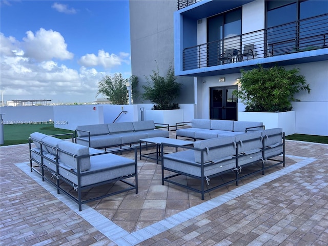 view of patio / terrace featuring a balcony and an outdoor hangout area