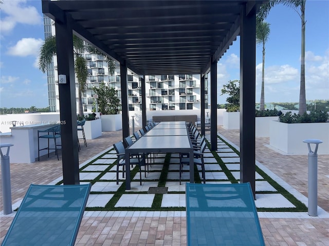 view of patio with a pergola and exterior bar