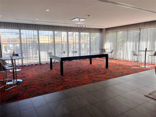 rec room featuring plenty of natural light and tile patterned flooring