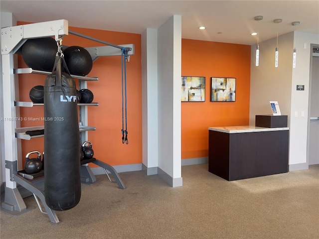 exercise room featuring light colored carpet