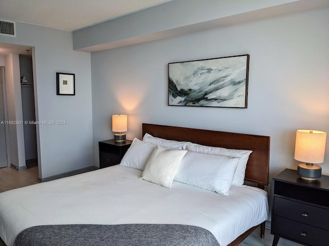 bedroom featuring hardwood / wood-style floors