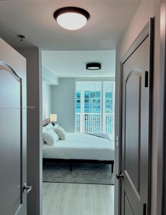 1200 Brickell Bay Dr Unit Ph4204, Miami, FL 33131 - bedroom featuring light wood-type flooring