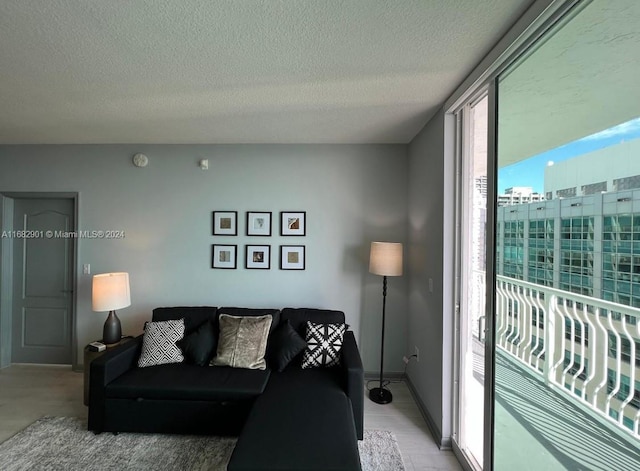 1200 Brickell Bay Dr Unit Ph4204, Miami, FL 33131 - living room with a textured ceiling and baseboards