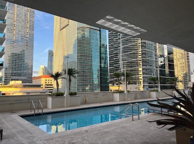 view of swimming pool featuring a patio area