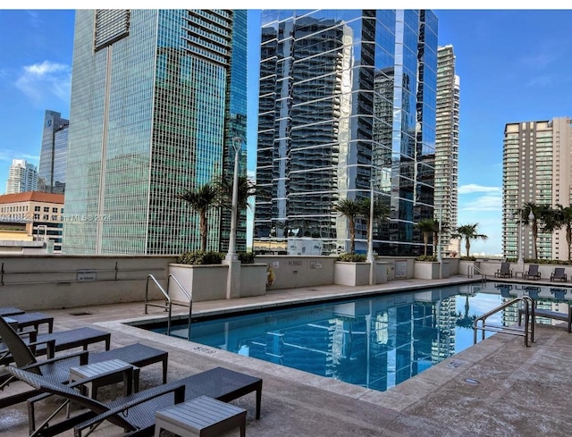 view of swimming pool with a patio