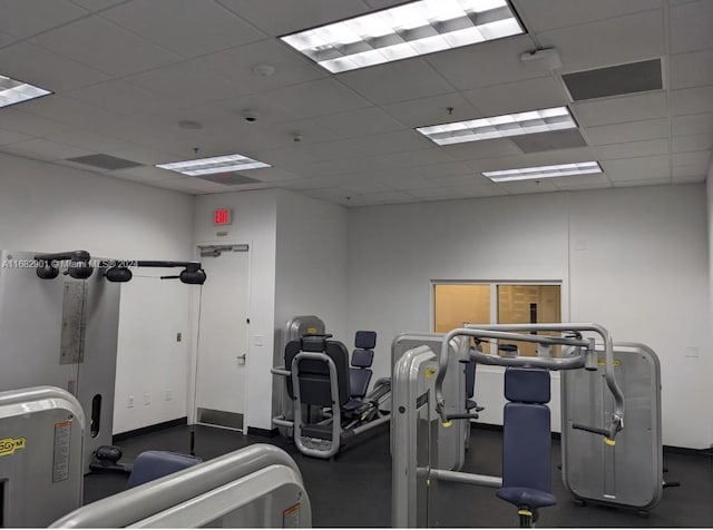 gym featuring a paneled ceiling