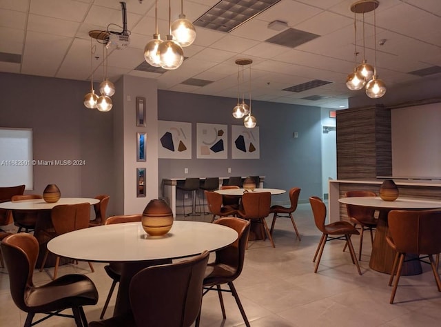 dining room featuring a paneled ceiling