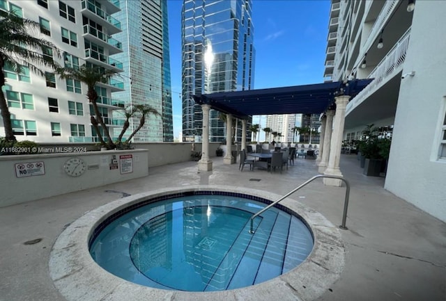 1200 Brickell Bay Dr Unit Ph4204, Miami, FL 33131 - view of swimming pool featuring a patio area, a city view, and outdoor dining area
