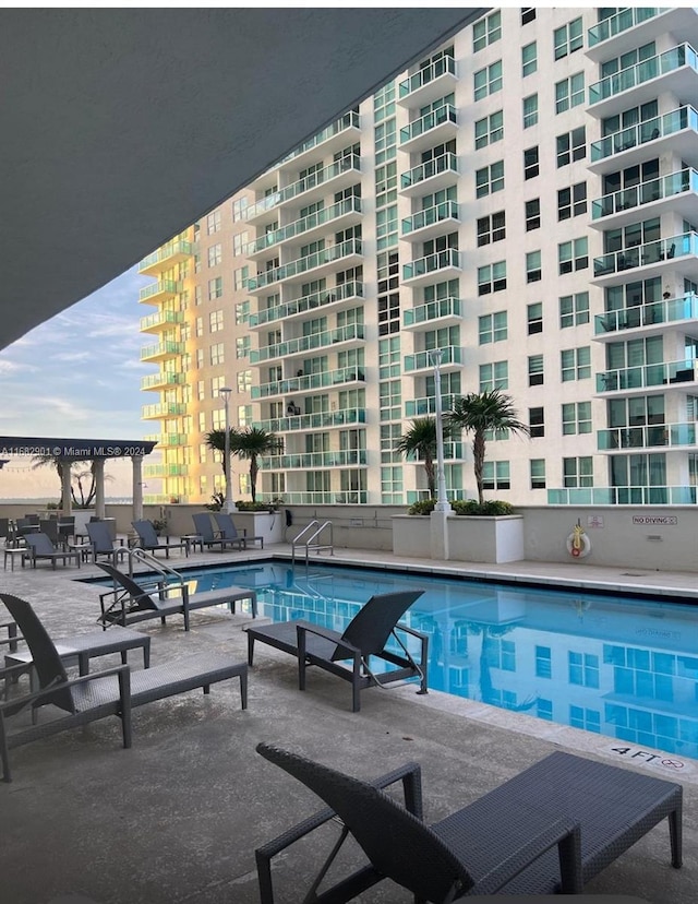 view of pool with a patio area