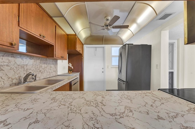 330 SE 2nd St Unit 303F, Hallandale Beach, FL 33009 - kitchen featuring visible vents, ceiling fan, a sink, backsplash, and stainless steel appliances