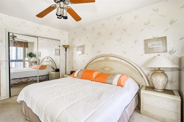 carpeted bedroom with a closet and ceiling fan