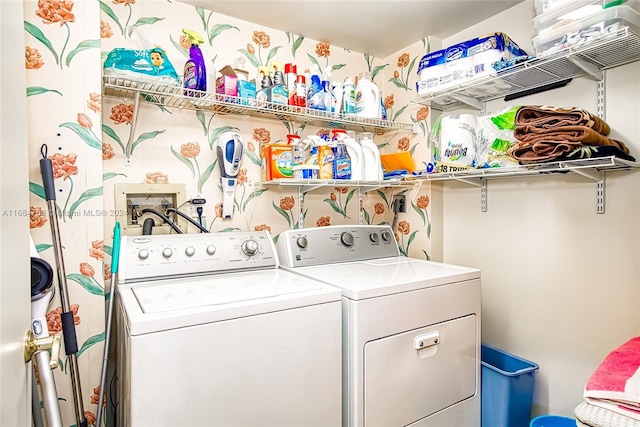 laundry area with separate washer and dryer