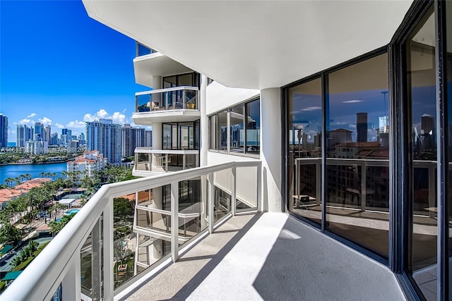 balcony featuring a water view