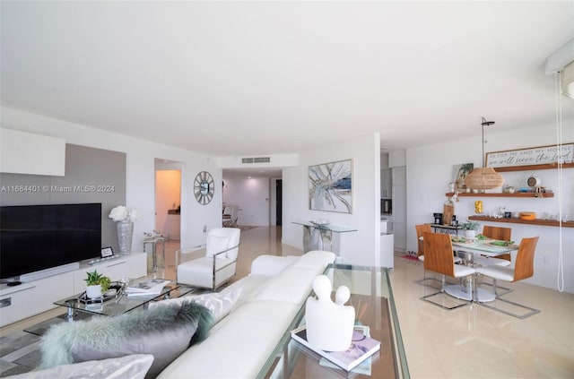 living room with light tile patterned floors