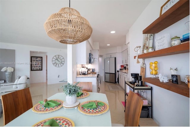 dining space featuring a chandelier