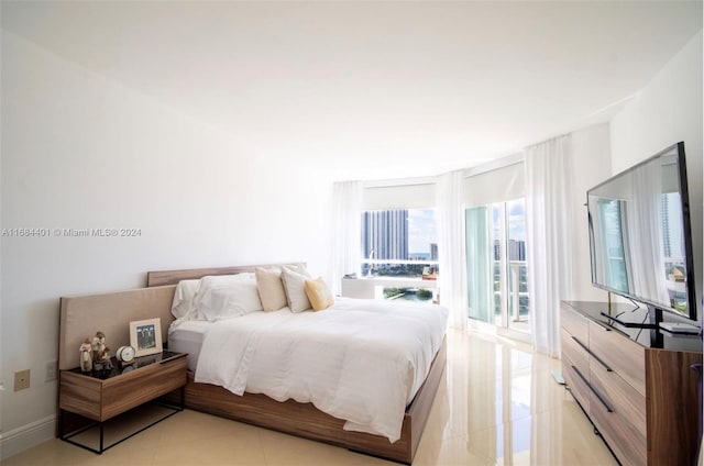 bedroom with light tile patterned flooring