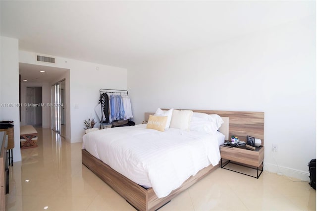 bedroom featuring light tile patterned floors