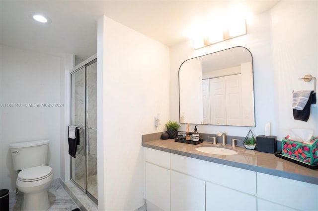 bathroom with vanity, toilet, and walk in shower