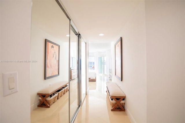 corridor with light tile patterned floors