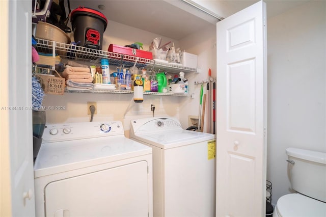 washroom with independent washer and dryer