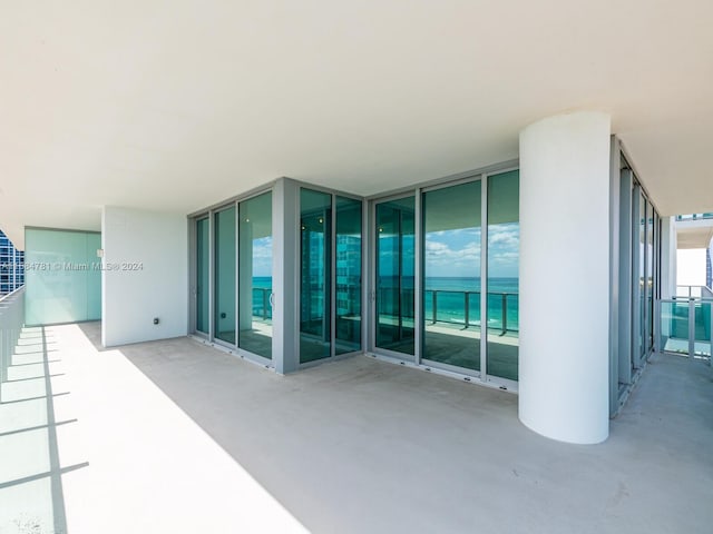 view of patio featuring a balcony