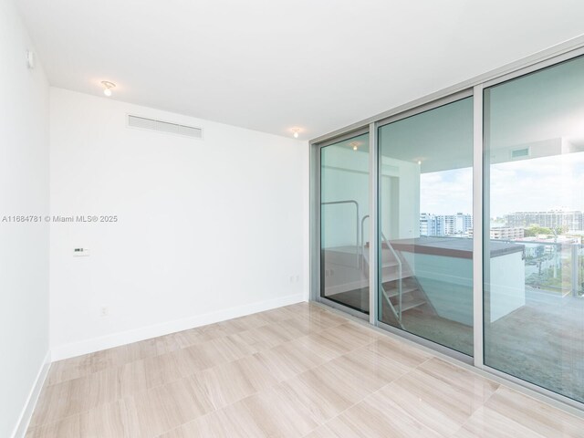 empty room with floor to ceiling windows