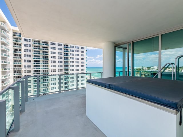 balcony featuring a water view