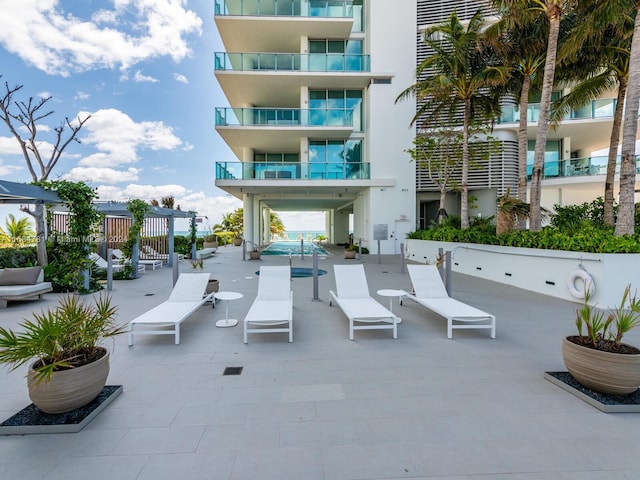 surrounding community featuring a patio area