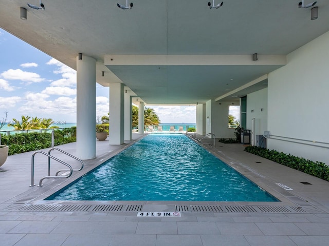 view of swimming pool featuring a patio area